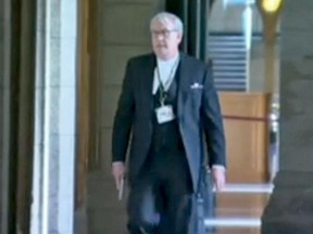 Sergeant at Arms Kevin Vickers with his weapon in Centre Block yesterday.