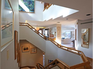 An elaborate central staircase that stretches up to their master suite is also their laundry chute, Shirley Westeinde jokes.