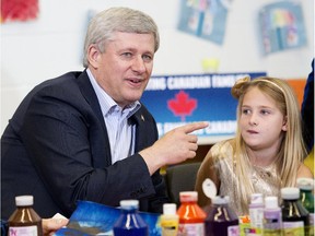 Prime Minister Stephen Harper does arts and crafts with a student at the Joseph and Wolf Lebovic Jewish Community Campus in Vaughan, Ont., on Thursday.