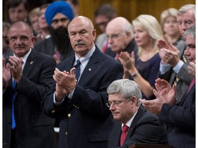 Prime Minister Stephen Harper is applauded after speaking on the government's motion on a combat mission in Iraq  in the House of Commons Oct. 3, 2014.