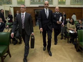 Minister of Public Safety and Emergency Preparedness Steven Blaney, CSIS Director Michel Coulombe and RCMP Commissioner Bob Paulson appear at the Commons National Security committee on Parliament Hill Wednesday October 8, 2014 in Ottawa.