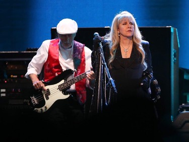 Stevie Nicks (R) and John McVie (L) of Fleetwood Mac perform during the On With the Show Tour 2014 at Canadian Tire Centre in Ottawa on October 26, 2014.