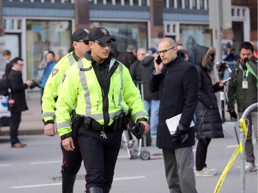 Although much of the area around the National War Memorial and Parliament is still blocked off with police barriers, people were allowed to pay their respects Thursday, laying flowers and notes for the soldier killed in the terrorist attack Wednesday in Ottawa. (Julie Oliver / Ottawa Citizen)