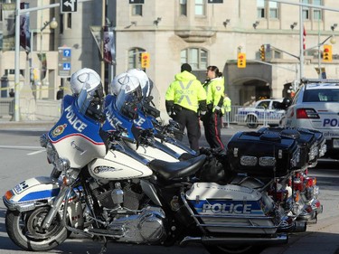Although much of the area around the National War Memorial and Parliament is still blocked off with police barriers, people were allowed to pay their respects Thursday, laying flowers and notes for the soldier killed in the terrorist attack Wednesday in Ottawa.