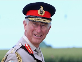 RANVILLE, FRANCE - JUNE 05:  Prince Charles, Prince of Wales laughs as he watches a parachute jump just outside Rainville during D-Day 70 Commemorations on June 5, 2014 in Ranville, France. Friday 6th June is the 70th anniversary of the D-Day landings which saw 156,000 troops from the allied countries including the United Kingdom and the United States join forces to launch an audacious attack on the beaches of Normandy,  these assaults are credited with the eventual defeat of Nazi Germany. A series of events commemorating the 70th anniversary are planned for the week with many heads of state travelling to the famous beaches to pay their respects to those who lost their lives.