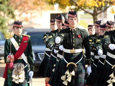 The Argyll and Sutherland Highlanders march in front of the hearse carrying the casket of Cpl. Nathan Cirillo before for its long escorted procession home to Hamilton from Ottawa Friday, October 24, 2104.