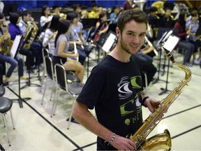 Tom Meredith is shown during a senior band rehearsal at Colonel By Secondary School.  The senior band was rehearsing a piece, composed by Abigail Richardson, based on the story of Meredith's great-grandfather's experience during the First World War.