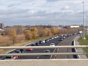 Traffic backs up along the 417 westbound as cars try to exit for the new Tanger Outlet on Friday.