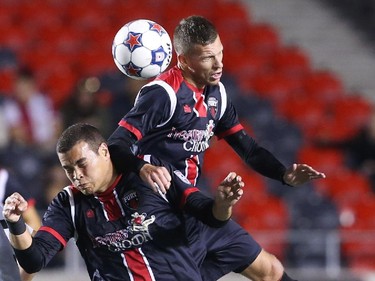 Vini Dantas, left, and Nicki Paterson of the Fury FC in action against the Atlanta Silverhawks during first half action.