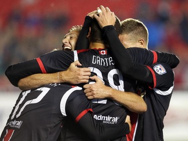 Vini Dantas, middle, of the Fury FC celebrates his goal with his team against the Atlanta Silverhawks during first half action.
