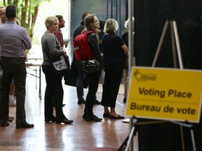 Voters line up at Ottawa City Hall as they wait to vote in an advance polls for the Oct. 27 municipal election.
