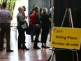 Voters line up at Ottawa City Hall as they wait to vote in advance polls.