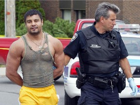 Files: Wahab Dadshani is taken into custody after the killing at Midway Family Fun Park in 2003.
