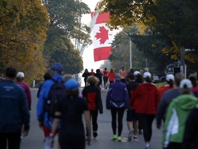 Walkers leave the start line at the 9 RUN RUN (Ottawa's Emergency Services' Run) in Stittsville on Saturday, October 18, 2014.