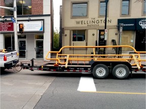 City of Ottawa truck hauls away bicycle corral.