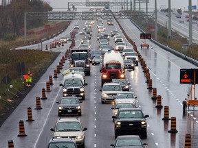 West bound (L) traffic on the Queensway, 417, looking east from the Eagleson Rd overpass, due to lane closures, traffic and construction.   Assignment - 118733 // Photo taken at 15:42 on October 20, 2014. (Wayne Cuddington/Ottawa Citizen)