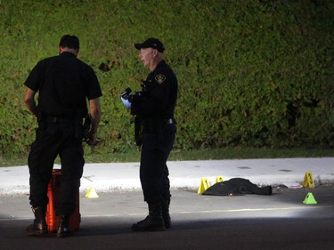 What appears to be a piece of clothing on the street, as OPP investigate a death on Charles St. near the corner of Daniel St. South in Arnprior, Ontario, Thursday, October 2, 2014. Paramedics found an injured women on the street near a blue pick-up truck, and took her to hospital, where she died. A man was arrested at the scene.