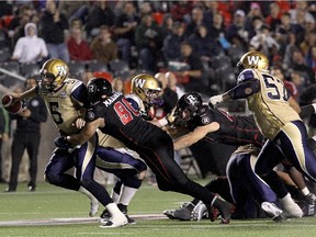 Winnipeg quarterback  Drew Willy found out how tough the Redblacks defence can be as he was taken down by Andrew Marshall during the game at TD Place Stadium on Oct. 3.