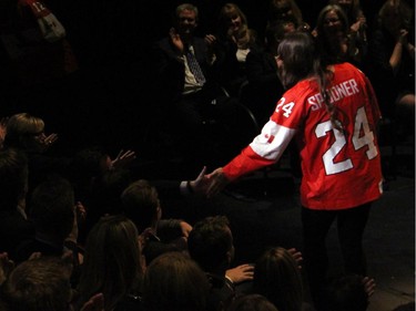 Women's hockey Olympic gold medalists Meaghan Mikkelson and Natalie Spooner high-five audience members during the Hope Live gala held at the GCTC on Monday, Oct. 27, 2014.