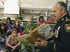 Ottawa Police chief Charles Bordeleau read to combined grade two/three class at Severn Public School on Monday.