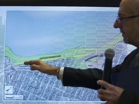 Arto Keklikian, principal transportation planner for the NCC with screen projection of area of contention where the NCC wants either the LRT to be underground or deviated across Rochester Field.