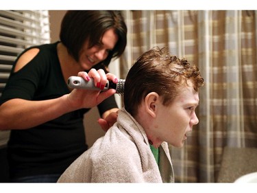 6 a.m.: After teeth brushing and washing comes the brushing of the hair, which Jonathan winces at when his mom accidentally hits a couple of sore spots on his head.