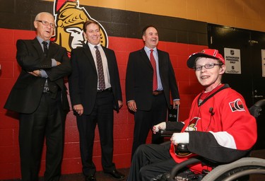 OTTAWA, ON - NOVEMBER 20: Jonathan Pitre meets with Ottawa Senators general manager Bryan Murray and assistant GM's Randy Lee and Pierre Dorion before signing a one day pro scouting contract prior to a game against the Nashville Predators at Canadian Tire Centre on November 20, 2014 in Ottawa, Ontario, Canada.  (Photo by Andre Ringuette/NHLI via Getty Images) ORG XMIT: 507047829