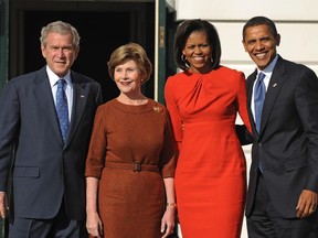 (L-R) US President George W. Bush, First Lady Laura Bush, Michelle Obama and president-elect Barack Obama stand outside the Diplomatic entrance of the White House on November 10, 2008 in Washington.