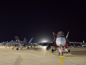 A Canadian Armed Forces CF-18 Fighter jet from 409 Squadron sits on the tarmac in Kuwait on Tuesday, October 28, 2014.