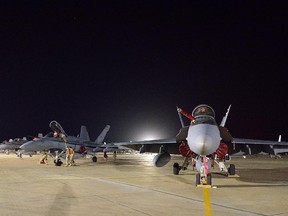 A Canadian Armed Forces CF-18 Fighter jet from 409 Squadron sits on the tarmac in Kuwait on Tuesday, October 28, 2014. THE CANADIAN PRESS/HO, DND-MND