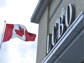 A Canadian flag flies near an under construction LCBO store in Bowmanville, Ontario on Saturday July 20, 2013.