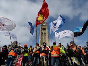 A group of First Nations adults and youth finish a spiritual journey from Attawapiskat First Nation to Parliament Hill in Ottawa on Monday, February 24, 2014. The twenty-five Indigenous walkers traveled 1700km with concerns about broken treaties, land and water protection, and, human rights issues.