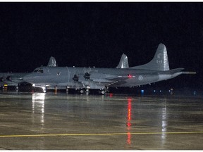 A CP-140M Aurora reconnaissance aircraft taxies as it leaves CFB Greenwood in Nova Scotia's Annapolis Valley on Friday, Oct. 24, 2014. The aircraft and personnel are participating in Operation IMPACT, as part of Canada's contribution to the war against the Islamic State in Iraq and the Levant.