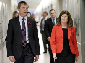 Federal Minister of Health Rona Ambrose (right) and Gregory Taylor, Chief Public Health Officer, tour the Level 4 lab at the National Microbiology Lab in Winnipeg on Nov. 3.