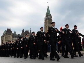 Canadian Forces members parade from Parliament Hill during the National Day of Honour in Ottawa on Friday, May 9, 2014. The commemoration honoured the soldiers who participated in the war in Afghanistan and included many of the family members of the 158 soldiers who died in the 12-year conflict.