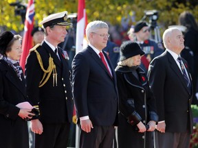 Princess Anne and her husband Sir Tim Laurence, Canadian Prime Minister Stephen Harper, his wife, Laureen, and Julian Fantino (Veteran Affairs Minister) watch  Remembrance Day ceremonies on Nov. 11, 2014.