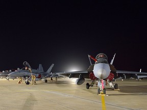 The Canadian Armed Forces CF-188 Air Task Force from 409 Squadron sits on the Canadian apron in Kuwait in support of Operation IMPACT on October 28, 2014.
 
Photo: Canadian Forces Combat Camera, DND
IS2014-5019-06