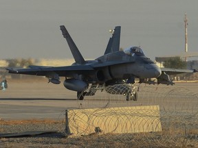 A Canadian Armed Forces CF-18 fighter jet in Kuwait taxis to takeoff for a morning mission over Iraq during Operation IMPACT on November 9, 2014.
 
Photo: Canadian Forces Combat Camera, DND
IS2014-7535-02