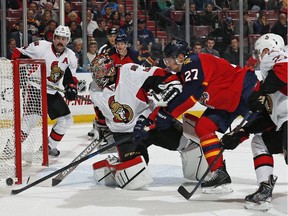 Ottawa Senators goaltender Craig Anderson (41) stops a shot by Florida Panthers forward Nick Bjugstad (27) during the first period of an NHL hockey game, Friday, Nov. 28, 2014, in Sunrise, Fla.