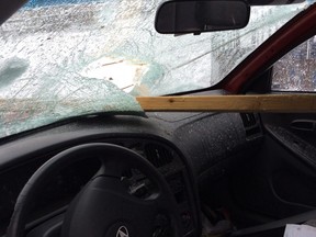 MRC des Collines police said a driver miraculously escaped injury when a fencepost smashed through her windshield after a crash Monday.