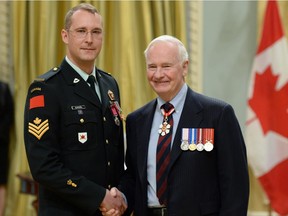 Gov. Gen. David Johnston presents the decoration of Bravery to Cpl. Dale Kurdziel earlier this year.