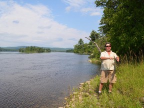 Daniel Gervais on the shoreline of the Ottawa River near the caves system