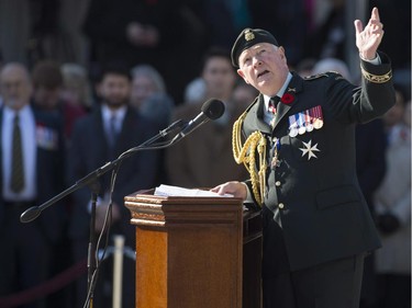 Governor General David Johnston motions towards the National War Memorial as he speaks during the Remembrance Day ceremony in Ottawa on Tuesday, Nov. 11, 2014.