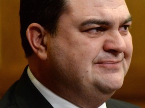 Dean Del Mastro holds back tears as he delivers his resignation statement in the House of Commons on Parliament Hill in Ottawa on Wednesday, Nov. 5, 2014.