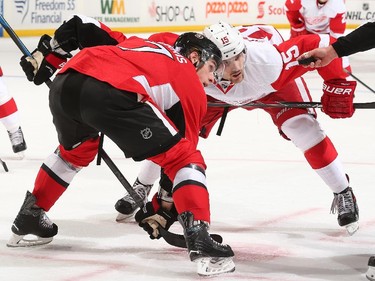 Kyle Turris #7 of the Ottawa Senators prepares for a faceoff against Riley Sheahan #15 of the Detroit Red Wings.