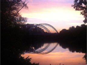 Sunrise over the Vimy Bridge, a graceful structure that opened in July to link South Ottawa communities across the Rideau River.