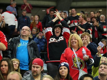 Fans enjoy the Sens goal in the second period.