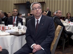 Federal Finance Minister Joe Oliver waits to deliver the Economic Update at a lunch meeting of The Canadian Club in Toronto on Wednesday.