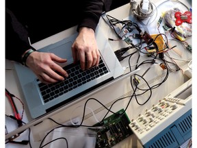 FILES - Picture taken on December 27, 2010 in Berlin shows a member of the Chaos Computer Club (CCC) working on his laptop. The German interior ministry promised on October 10, 2011 to clear up an affair about a spy software used by its authorities. A Trojan used by German investigative authorities and leaked to the CCC hackers organisation passes legal limits, the association said.     AFP PHOTO    TIM BRAKEMEIER    GERMANY OUT (Photo credit should read TIM BRAKEMEIER/AFP/Getty Images)