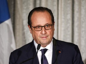 French President Francois Hollande, addresses a state dinner in Banff, Alta., Sunday, Nov. 2, 2014.